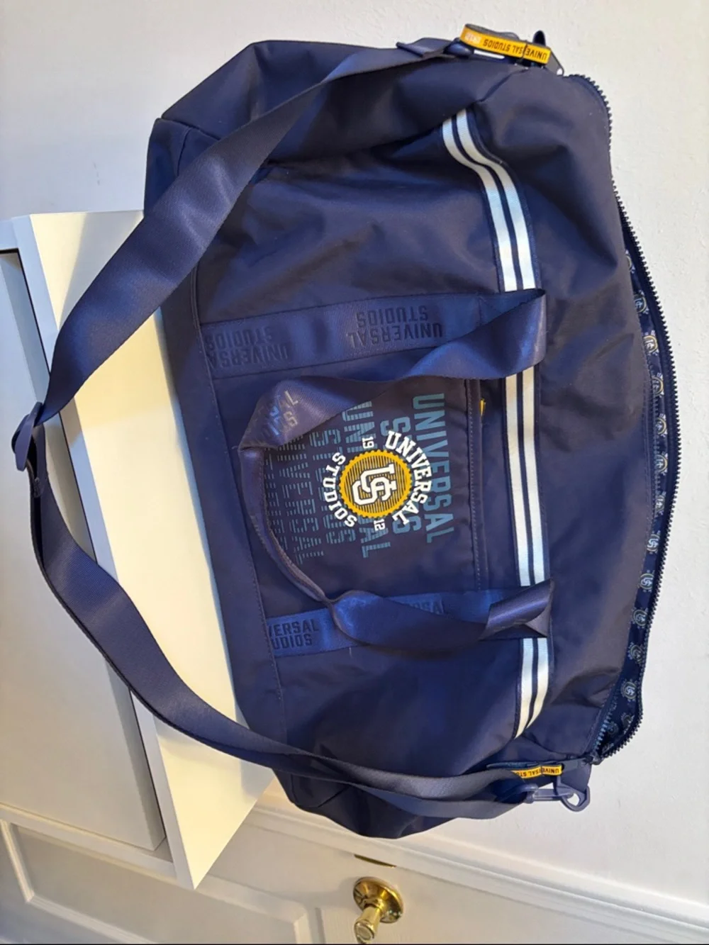 Limited 1912 Universal Studios Navy Duffel Bag with Yellow Logo Accent